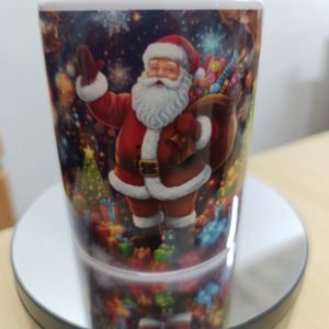Ceramic mug with colorful Christmas scene featuring Santa and a decorated Christmas tree